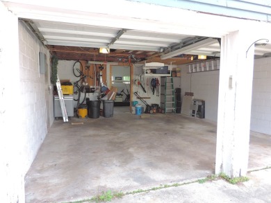Nestled on a quiet, tree-lined street within walking distance on Spring Green Golf Course in Wisconsin - for sale on GolfHomes.com, golf home, golf lot