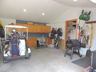 Nestled on a quiet, tree-lined street within walking distance on Spring Green Golf Course in Wisconsin - for sale on GolfHomes.com, golf home, golf lot
