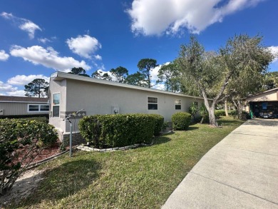 Lot Rent $1342.00 monthly  Beautiful stucco home located on a on Del Tura Golf and Country Club in Florida - for sale on GolfHomes.com, golf home, golf lot
