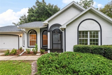 Welcome home to your little sanctuary tucked along the edge of a on Royal Oaks Golf Club in Florida - for sale on GolfHomes.com, golf home, golf lot