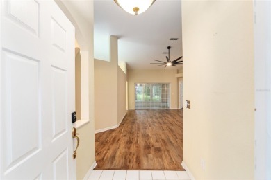 Welcome home to your little sanctuary tucked along the edge of a on Royal Oaks Golf Club in Florida - for sale on GolfHomes.com, golf home, golf lot