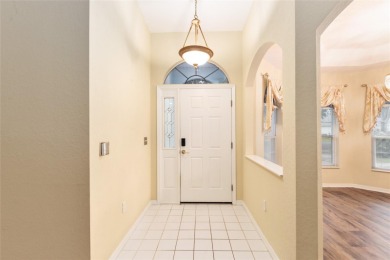 Welcome home to your little sanctuary tucked along the edge of a on Royal Oaks Golf Club in Florida - for sale on GolfHomes.com, golf home, golf lot