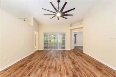Welcome home to your little sanctuary tucked along the edge of a on Royal Oaks Golf Club in Florida - for sale on GolfHomes.com, golf home, golf lot