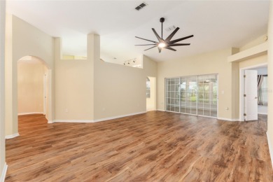 Welcome home to your little sanctuary tucked along the edge of a on Royal Oaks Golf Club in Florida - for sale on GolfHomes.com, golf home, golf lot