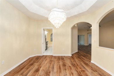 Welcome home to your little sanctuary tucked along the edge of a on Royal Oaks Golf Club in Florida - for sale on GolfHomes.com, golf home, golf lot