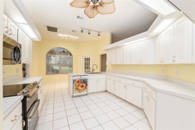 Welcome home to your little sanctuary tucked along the edge of a on Royal Oaks Golf Club in Florida - for sale on GolfHomes.com, golf home, golf lot