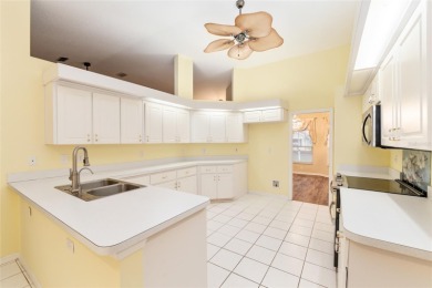 Welcome home to your little sanctuary tucked along the edge of a on Royal Oaks Golf Club in Florida - for sale on GolfHomes.com, golf home, golf lot