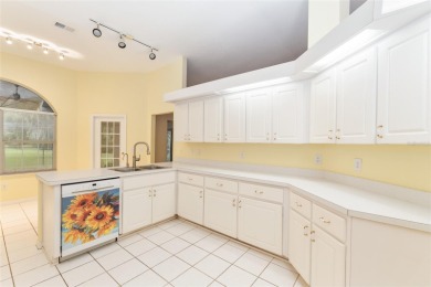 Welcome home to your little sanctuary tucked along the edge of a on Royal Oaks Golf Club in Florida - for sale on GolfHomes.com, golf home, golf lot