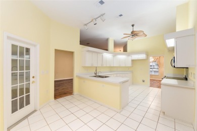 Welcome home to your little sanctuary tucked along the edge of a on Royal Oaks Golf Club in Florida - for sale on GolfHomes.com, golf home, golf lot