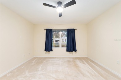 Welcome home to your little sanctuary tucked along the edge of a on Royal Oaks Golf Club in Florida - for sale on GolfHomes.com, golf home, golf lot