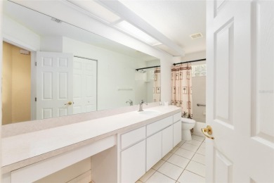 Welcome home to your little sanctuary tucked along the edge of a on Royal Oaks Golf Club in Florida - for sale on GolfHomes.com, golf home, golf lot