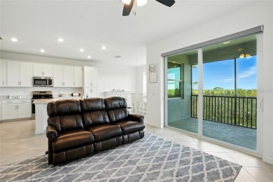 TOP FLOOR Birkdale floorplan with spectacular water and nature on Heritage Landing Golf  in Florida - for sale on GolfHomes.com, golf home, golf lot