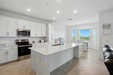 TOP FLOOR Birkdale floorplan with spectacular water and nature on Heritage Landing Golf  in Florida - for sale on GolfHomes.com, golf home, golf lot