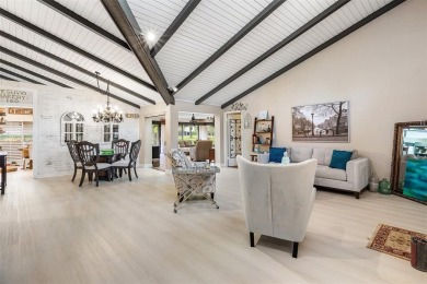 This impeccably remodeled 3 bdr residence is a true standout In on Woodmont Country Club in Florida - for sale on GolfHomes.com, golf home, golf lot