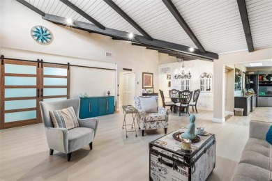This impeccably remodeled 3 bdr residence is a true standout In on Woodmont Country Club in Florida - for sale on GolfHomes.com, golf home, golf lot
