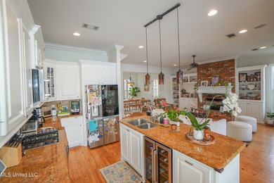 This stunning Lake Caroline waterfront home offers the perfect on Lake Caroline Golf Club in Mississippi - for sale on GolfHomes.com, golf home, golf lot