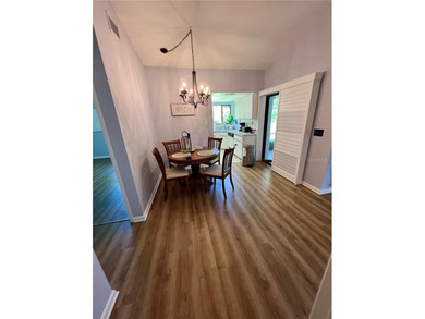 Welcome to 6 Willow Grove Place, a beautiful home nestled in a on The Grand Club - Pine Lakes Course in Florida - for sale on GolfHomes.com, golf home, golf lot