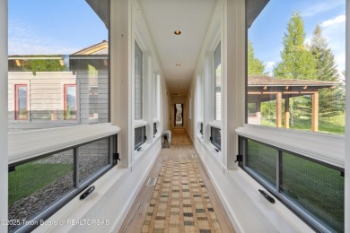 Designed by renowned local architects Dubbe Moulder and on Jackson Hole Golf and Tennis Club in Wyoming - for sale on GolfHomes.com, golf home, golf lot