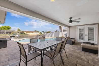WATERFRONT POOL HOME in the coveted DANA SHORES community of on Rocky Point Golf Course in Florida - for sale on GolfHomes.com, golf home, golf lot