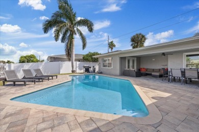 WATERFRONT POOL HOME in the coveted DANA SHORES community of on Rocky Point Golf Course in Florida - for sale on GolfHomes.com, golf home, golf lot