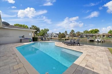 WATERFRONT POOL HOME in the coveted DANA SHORES community of on Rocky Point Golf Course in Florida - for sale on GolfHomes.com, golf home, golf lot