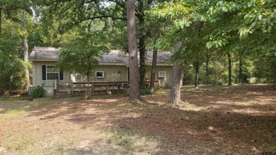 Escape to the country in scenic and relaxing Holly Lake Ranch on Holly Lake Ranch Golf Club in Texas - for sale on GolfHomes.com, golf home, golf lot