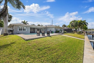 WATERFRONT POOL HOME in the coveted DANA SHORES community of on Rocky Point Golf Course in Florida - for sale on GolfHomes.com, golf home, golf lot