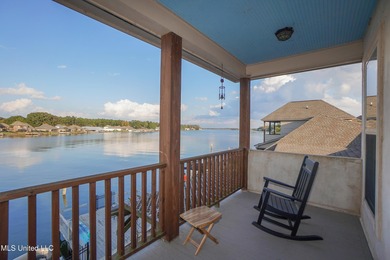 This stunning Lake Caroline waterfront home offers the perfect on Lake Caroline Golf Club in Mississippi - for sale on GolfHomes.com, golf home, golf lot