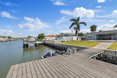 WATERFRONT POOL HOME in the coveted DANA SHORES community of on Rocky Point Golf Course in Florida - for sale on GolfHomes.com, golf home, golf lot