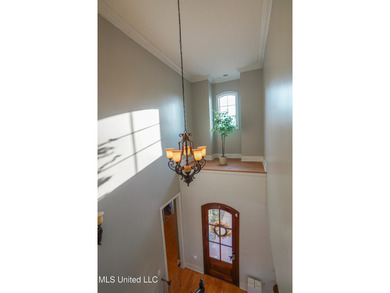 This stunning Lake Caroline waterfront home offers the perfect on Lake Caroline Golf Club in Mississippi - for sale on GolfHomes.com, golf home, golf lot