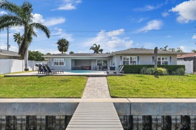 WATERFRONT POOL HOME in the coveted DANA SHORES community of on Rocky Point Golf Course in Florida - for sale on GolfHomes.com, golf home, golf lot