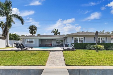 WATERFRONT POOL HOME in the coveted DANA SHORES community of on Rocky Point Golf Course in Florida - for sale on GolfHomes.com, golf home, golf lot