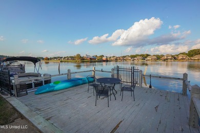 This stunning Lake Caroline waterfront home offers the perfect on Lake Caroline Golf Club in Mississippi - for sale on GolfHomes.com, golf home, golf lot