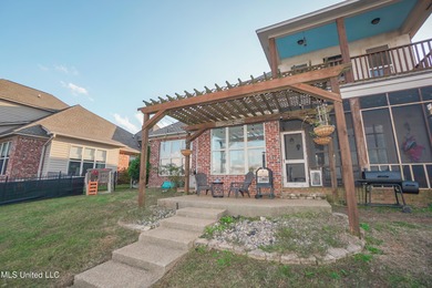 This stunning Lake Caroline waterfront home offers the perfect on Lake Caroline Golf Club in Mississippi - for sale on GolfHomes.com, golf home, golf lot