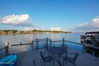 This stunning Lake Caroline waterfront home offers the perfect on Lake Caroline Golf Club in Mississippi - for sale on GolfHomes.com, golf home, golf lot