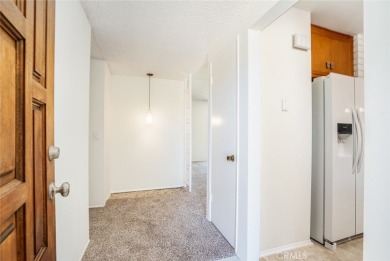 This lovely beach home resides in the center of the Huntington on Meadowlark Golf Club in California - for sale on GolfHomes.com, golf home, golf lot