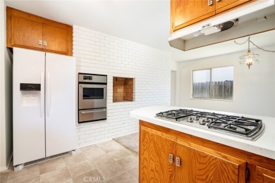 This lovely beach home resides in the center of the Huntington on Meadowlark Golf Club in California - for sale on GolfHomes.com, golf home, golf lot