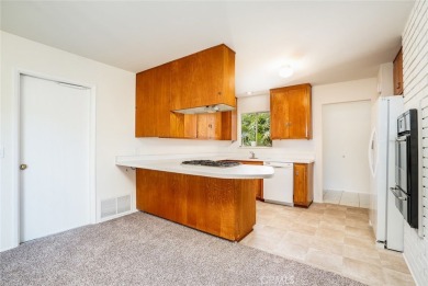 This lovely beach home resides in the center of the Huntington on Meadowlark Golf Club in California - for sale on GolfHomes.com, golf home, golf lot