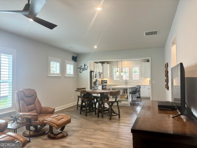 Imagine starting your mornings with coffee on a covered lanai on Canongate Golf At Sun City Peachtree in Georgia - for sale on GolfHomes.com, golf home, golf lot
