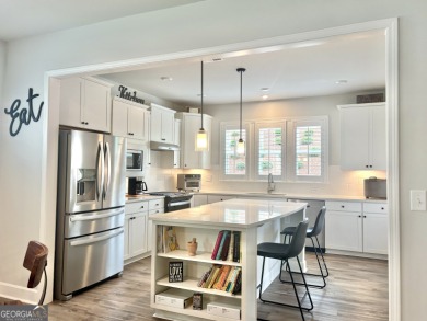 Imagine starting your mornings with coffee on a covered lanai on Canongate Golf At Sun City Peachtree in Georgia - for sale on GolfHomes.com, golf home, golf lot
