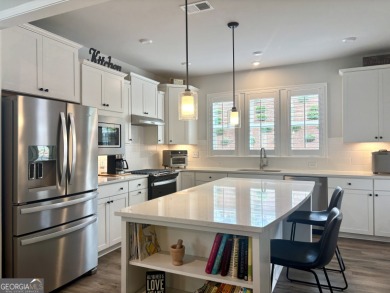 Imagine starting your mornings with coffee on a covered lanai on Canongate Golf At Sun City Peachtree in Georgia - for sale on GolfHomes.com, golf home, golf lot