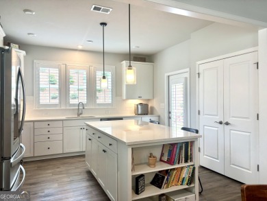 Imagine starting your mornings with coffee on a covered lanai on Canongate Golf At Sun City Peachtree in Georgia - for sale on GolfHomes.com, golf home, golf lot