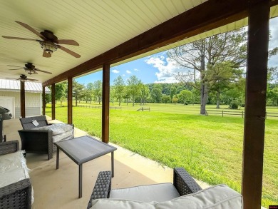 Just steps from the White River, this custom-built 2-bedroom on Rivercliff Golf Course in Arkansas - for sale on GolfHomes.com, golf home, golf lot