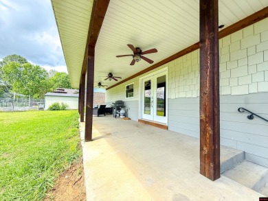 Just steps from the White River, this custom-built 2-bedroom on Rivercliff Golf Course in Arkansas - for sale on GolfHomes.com, golf home, golf lot