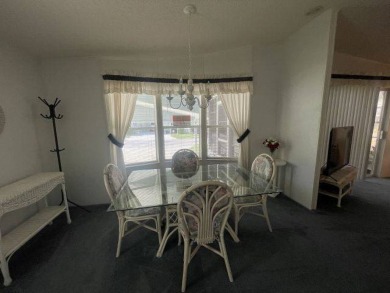 NEW REDUCED PRICE ~ $89,900! Located adjacent to a Florida on Four Lakes Golf Club in Florida - for sale on GolfHomes.com, golf home, golf lot
