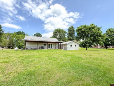 Just steps from the White River, this custom-built 2-bedroom on Rivercliff Golf Course in Arkansas - for sale on GolfHomes.com, golf home, golf lot