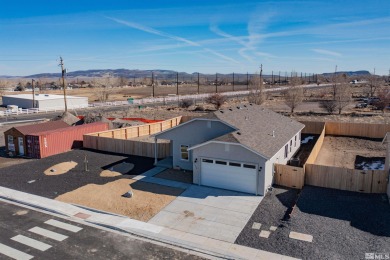 This 1597 sqft new home is located on an oversized lot with RV on The Golf Club of Fernley in Nevada - for sale on GolfHomes.com, golf home, golf lot