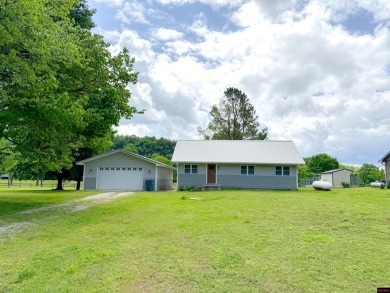 Just steps from the White River, this custom-built 2-bedroom on Rivercliff Golf Course in Arkansas - for sale on GolfHomes.com, golf home, golf lot