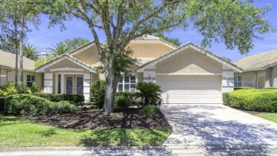 Welcome home to this beautifully maintained 3-bedroom on Plantation Bay Golf and Country Club in Florida - for sale on GolfHomes.com, golf home, golf lot