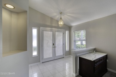 Welcome home to this beautifully maintained 3-bedroom on Plantation Bay Golf and Country Club in Florida - for sale on GolfHomes.com, golf home, golf lot